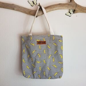 Black and white striped tote with bananas